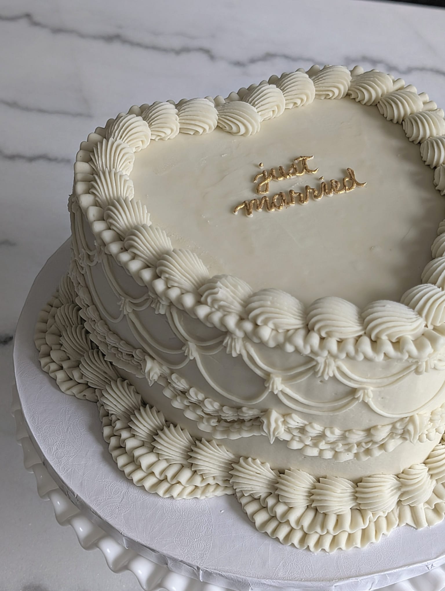 Ivory vintage heart cake with just married in gold script